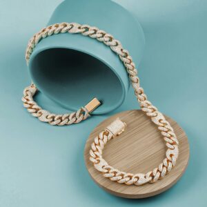 Luxurious gold and diamond-studded chain displayed artistically on a teal backdrop.